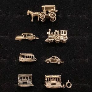 Seven Silver Transportation Charms